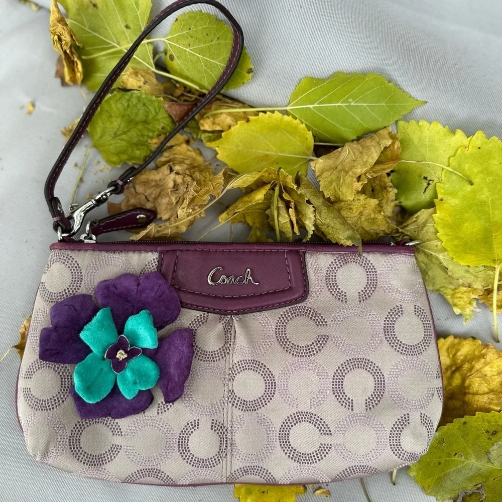 Coach Wristlet with suede flowers. Upstyled for a fresh new look. 9.25x5.5 x1”